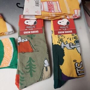 2 snoopy socks or 2 ramen noodle socks adult size